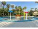 A colorful splash pad with playful water features, perfect for Gathering fun in a beautifully landscaped area at 3844 Silverlake Way, Wesley Chapel, FL 33544