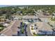 Birds-eye view of a new construction site, emphasizing residential layouts, road networks, and landscaping details at 414 Finn Way # 4, Dunedin, FL 34698