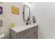 Stylish bathroom featuring a sleek vanity with modern fixtures, a minimalist mirror, and contemporary decor at 414 Finn Way # 4, Dunedin, FL 34698