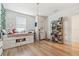 Bright bedroom featuring built-in storage, a modern light fixture, and ample natural light at 414 Finn Way # 4, Dunedin, FL 34698