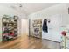Bright bedroom featuring stylish shelving, a modern light fixture, and ample natural light at 414 Finn Way # 4, Dunedin, FL 34698