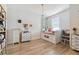 Charming bedroom with built-in storage, a modern light fixture, and warm natural light at 414 Finn Way # 4, Dunedin, FL 34698