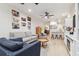 Comfortable living room with a ceiling fan, plush sofas and an open floor plan to the kitchen at 414 Finn Way # 4, Dunedin, FL 34698
