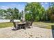 A lovely outdoor patio area is great for entertaining guests with views of the green backyard at 4161 Rolling Springs Dr, Tampa, FL 33624