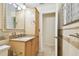 Bathroom featuring a vanity with stone countertops and decorative tile at 4161 Rolling Springs Dr, Tampa, FL 33624