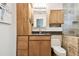 Bathroom featuring granite counters, cabinets, and a tiled shower at 4161 Rolling Springs Dr, Tampa, FL 33624