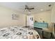 Neutral colored bedroom with ceiling fan and ensuite bathroom at 4161 Rolling Springs Dr, Tampa, FL 33624