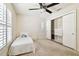 Clean bedroom with a ceiling fan, closet with built-in storage, and ample light at 4161 Rolling Springs Dr, Tampa, FL 33624