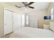 Bright bedroom features neutral decor, closet space, and white furniture creating a peaceful, inviting atmosphere at 4161 Rolling Springs Dr, Tampa, FL 33624