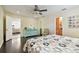 Spacious bedroom with ensuite, chair and dresser at 4161 Rolling Springs Dr, Tampa, FL 33624