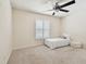Neutral bedroom with a fan, single bed, and plantation shutters offering light control at 4161 Rolling Springs Dr, Tampa, FL 33624