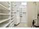 Walk in closet with many shelves at 4161 Rolling Springs Dr, Tampa, FL 33624