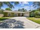 Charming single-story home with well-maintained landscaping and a spacious driveway at 4161 Rolling Springs Dr, Tampa, FL 33624