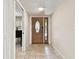 Bright foyer with tile flooring and a decorative front door at 4161 Rolling Springs Dr, Tampa, FL 33624
