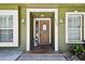 Inviting entryway with a decorative front door and well-manicured landscaping at 4161 Rolling Springs Dr, Tampa, FL 33624