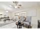 Bright living area with chandelier, ceiling fan, and seamless flow to adjacent spaces at 4161 Rolling Springs Dr, Tampa, FL 33624