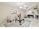 Well-lit living area with tile floors, fan, chandelier and an inviting atmosphere at 4161 Rolling Springs Dr, Tampa, FL 33624