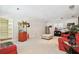 Living room with red couches, popcorn machine, and access to storage at 4161 Rolling Springs Dr, Tampa, FL 33624