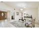 Spacious living area with wood front door, tile floors, neutral paint, and contemporary furnishings at 4161 Rolling Springs Dr, Tampa, FL 33624