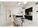 Comfortable living room featuring stylish furnishings and an open layout to the dining area at 4161 Rolling Springs Dr, Tampa, FL 33624