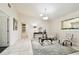 Open-concept living area with tile floors, ample natural light, and stylish decor at 4161 Rolling Springs Dr, Tampa, FL 33624