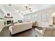 Bright living room with hardwood floors, stone fireplace, ceiling fans, and lots of natural light at 4161 Rolling Springs Dr, Tampa, FL 33624