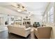 Open concept living room with a fireplace, hardwood floors, and view into dining room at 4161 Rolling Springs Dr, Tampa, FL 33624