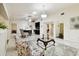 Open-concept living area with tile flooring and seamless flow into kitchen and other spaces at 4161 Rolling Springs Dr, Tampa, FL 33624