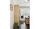 Home office with built-in shelving, natural light, and wood flooring creating a functional workspace at 4161 Rolling Springs Dr, Tampa, FL 33624