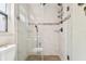 Modern tiled shower features a glass door, rain shower head and stylish fixtures at 4161 Rolling Springs Dr, Tampa, FL 33624