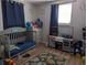 Quaint bedroom with neutral walls, hardwood floors, and a playful atmosphere at 4581 Deltona Blvd, Spring Hill, FL 34606