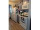 Practical kitchen offering essential appliances, sufficient counter space, and easy access to the laundry area at 4581 Deltona Blvd, Spring Hill, FL 34606