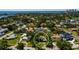 Aerial view shows the property nestled in a mature neighborhood with skyline and water views at 459 Bayview Ne Dr, St Petersburg, FL 33704