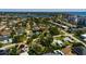Aerial view of a home with a lush, green lawn situated in a neighborhood near the bay waters at 459 Bayview Ne Dr, St Petersburg, FL 33704