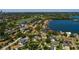 Aerial view of homes near open bay featuring waterfront residences, lush foliage and beautiful waterways at 459 Bayview Ne Dr, St Petersburg, FL 33704