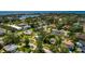 Wide aerial view highlighting a home's proximity to a tranquil lake and community at 459 Bayview Ne Dr, St Petersburg, FL 33704