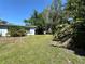 Spacious backyard with lush greenery, offering privacy at 459 Bayview Ne Dr, St Petersburg, FL 33704