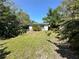 Private backyard with mature trees and green space at 459 Bayview Ne Dr, St Petersburg, FL 33704