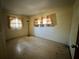 Bedroom with vintage curtains and a patterned floor at 459 Bayview Ne Dr, St Petersburg, FL 33704
