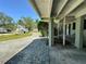 Paver driveway leading to the home's covered entrance, framed by mature landscaping at 459 Bayview Ne Dr, St Petersburg, FL 33704