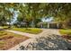 Suburban home with lush landscaping and driveway at 459 Bayview Ne Dr, St Petersburg, FL 33704