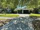 Street view showcasing a home with a lush front lawn, driveway, and attached garage at 459 Bayview Ne Dr, St Petersburg, FL 33704