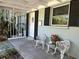 Charming covered front porch area with seating and well-maintained details at 459 Bayview Ne Dr, St Petersburg, FL 33704