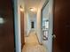Hallway leading to various rooms, offering a glimpse of the home's layout and neutral color scheme at 459 Bayview Ne Dr, St Petersburg, FL 33704