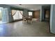 Open-concept living space with a dining table near the windows, showing a light-filled interior at 459 Bayview Ne Dr, St Petersburg, FL 33704