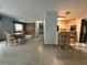Spacious living area with a dining table and an open layout connected to the kitchen with breakfast bar at 459 Bayview Ne Dr, St Petersburg, FL 33704