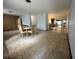 Bright living room featuring a dining area with a round table and multiple chairs in an open layout at 459 Bayview Ne Dr, St Petersburg, FL 33704