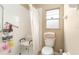 This bathroom offers a convenient shower seat, grab bars, and ample storage for a comfortable and safe bathing experience at 4656 Copper Hill Dr, Spring Hill, FL 34609
