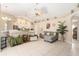 Bright living room with tile flooring, ceiling fan, neutral paint, and furniture perfect for relaxation at 4656 Copper Hill Dr, Spring Hill, FL 34609