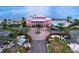 Aerial view showcases a waterfront community with a large pool and ocean access at 4799 Coquina Key Se Dr, St Petersburg, FL 33705